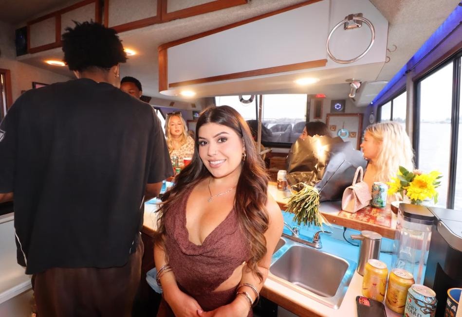 Friends celebrating inside the Paradise Party Yacht cabin — private boat party San Diego Bay