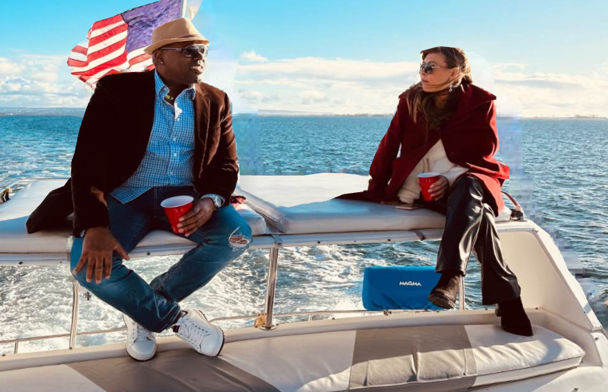 Couple relaxing on private yacht charter on San Diego Bay with American flag flying
