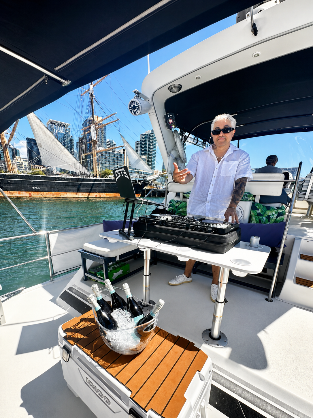 San Diego party boat — DJ performing on private yacht charter deck on San Diego Bay