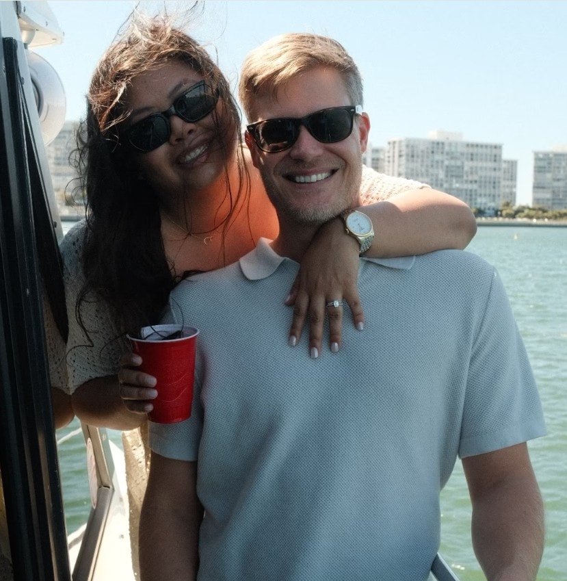 Couple smiling on San Diego Bay private yacht charter — boat rental with downtown skyline backdrop