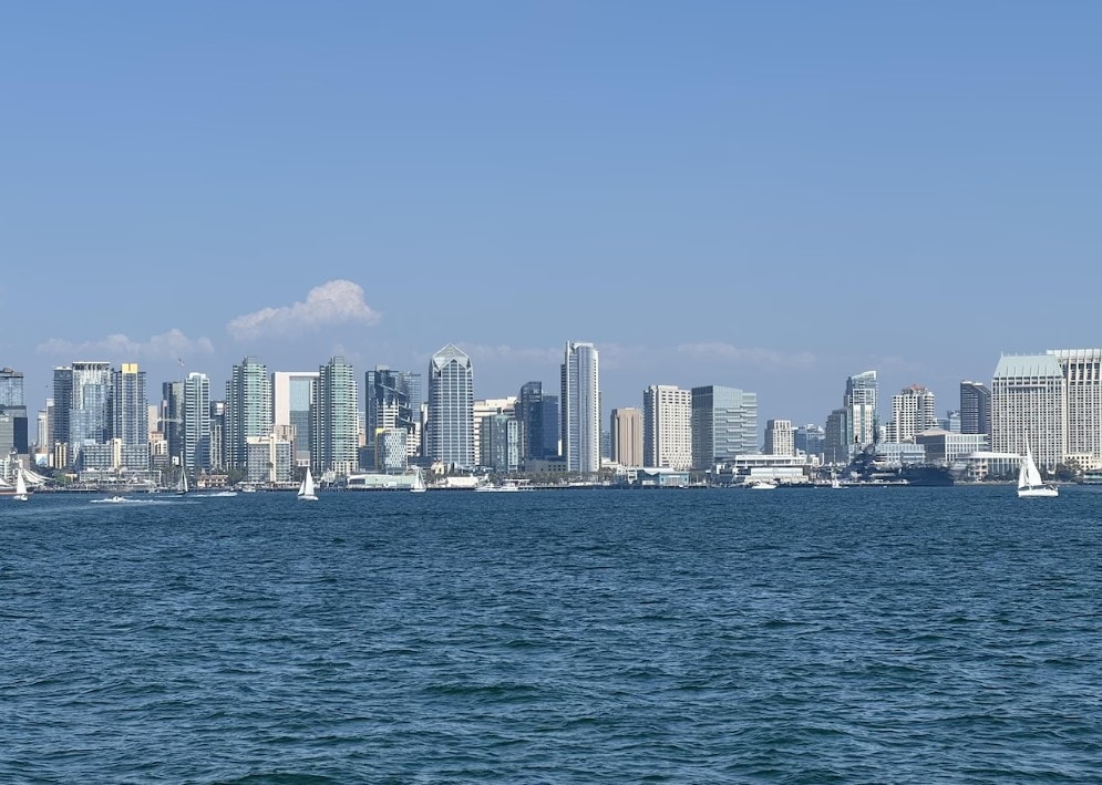 San Diego Bay cruise — downtown skyline and sailboats viewed from private yacht charter on the bay