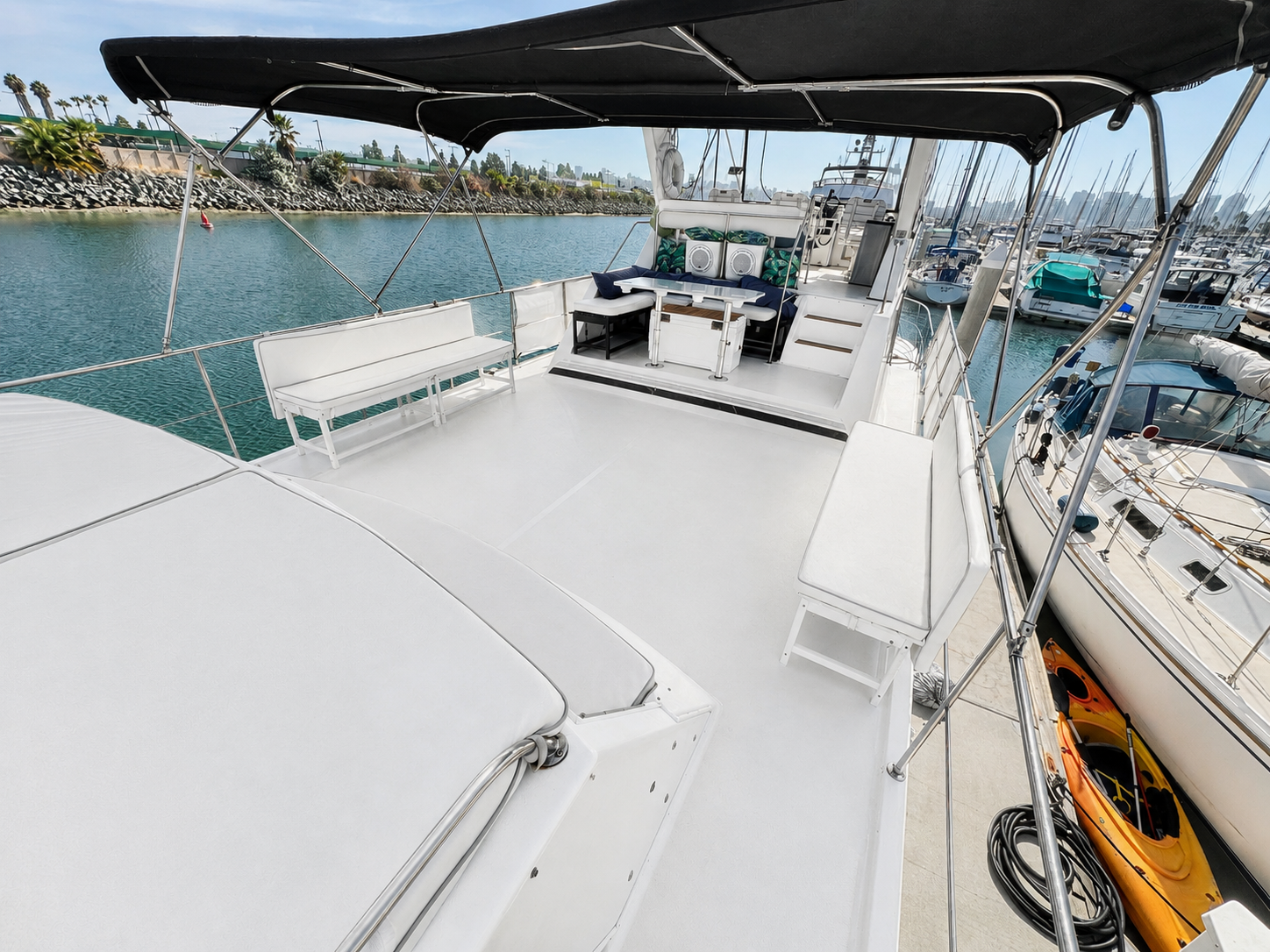 Yacht main deck San Diego — spacious open deck with canopy and bench seating on the Paradise Party Yacht