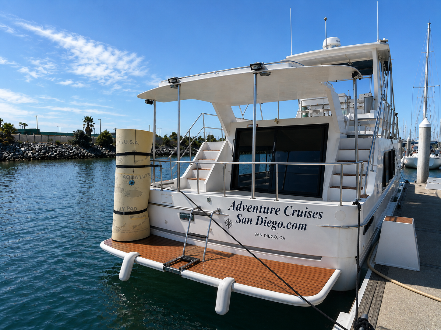 Adventure Cruises San Diego — rear view of the Paradise yacht docked at Harbor Island marina