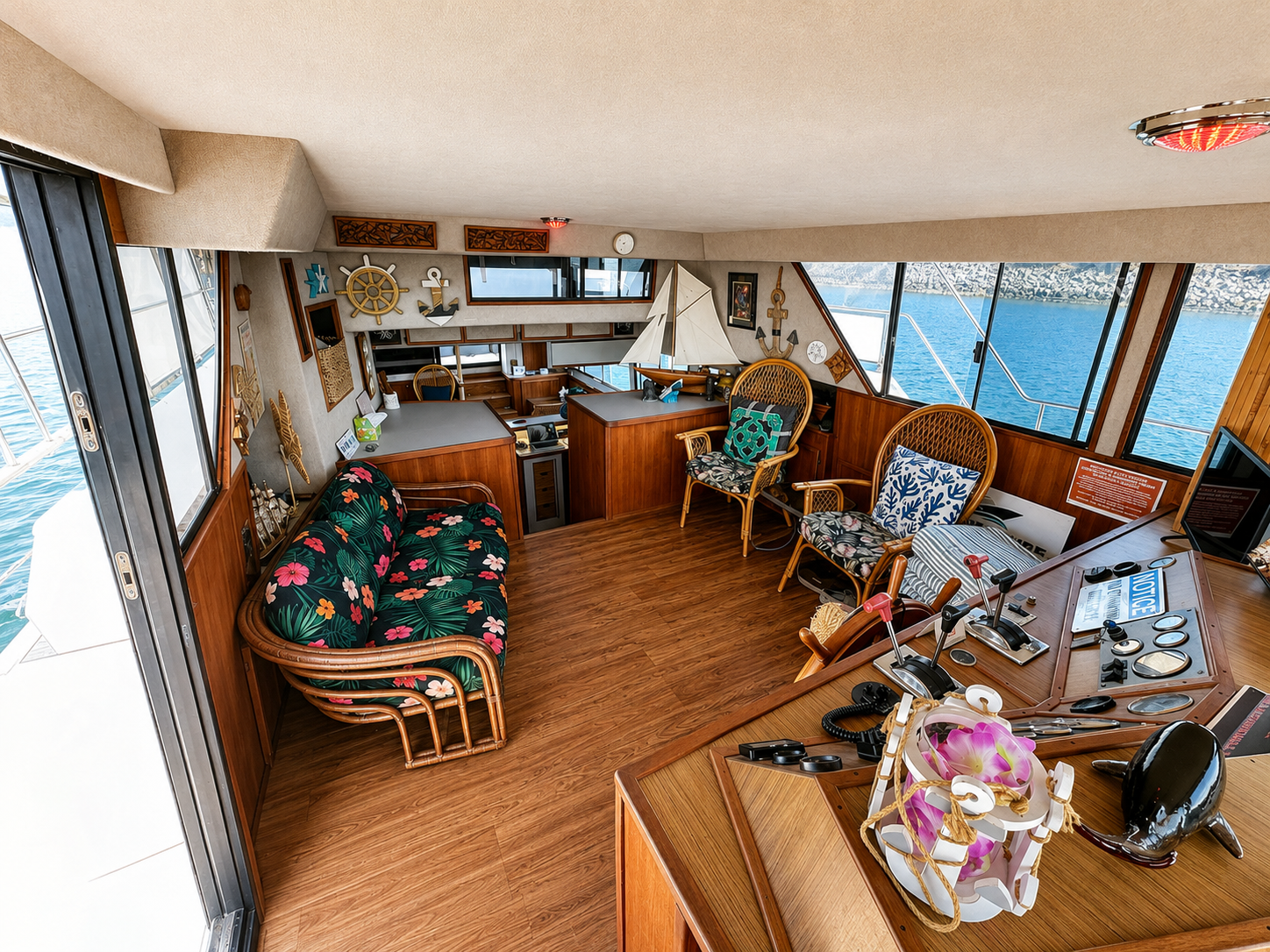 Yacht interior San Diego — captain helm and tropical lounge area aboard the Paradise charter yacht